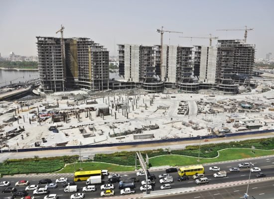 distant shot of an urban area with cars on the street and high buildings